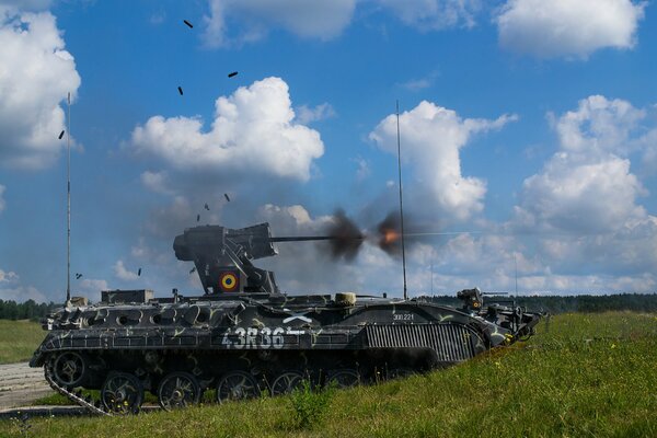 Combat military armored vehicles tank machine gunner gives a volley