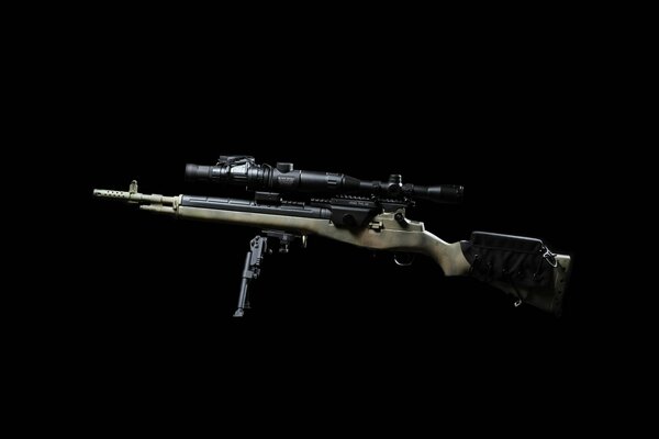 Semi-automatic rifle with optical sight on a black background