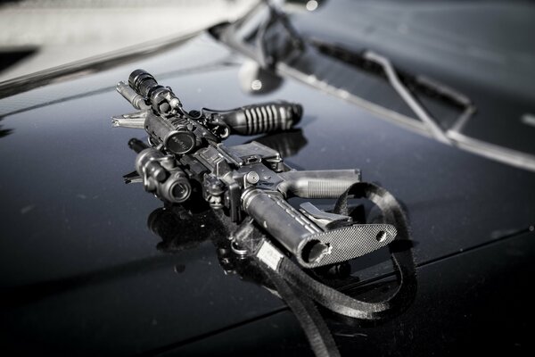 AR-15 assault rifle on the hood