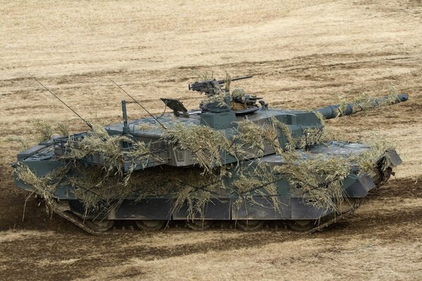 Camouflaged Japanese battle tank on the field
