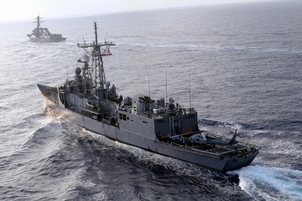 A floating ship at sea, sailors on a hike