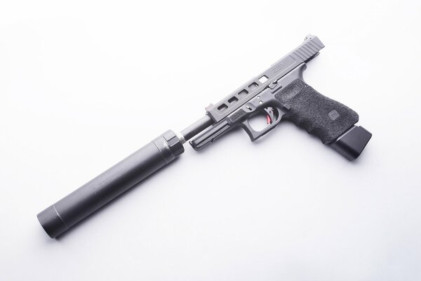 Self-loading pistol with a silencer on a white background