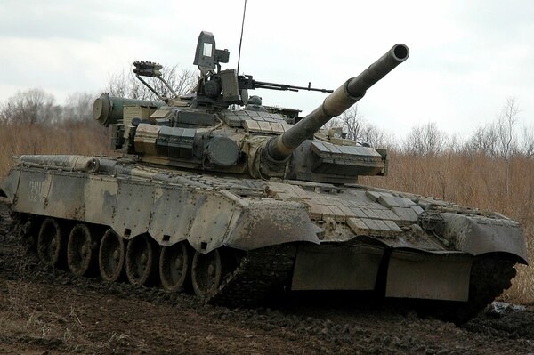 Battle tank in a muddy field