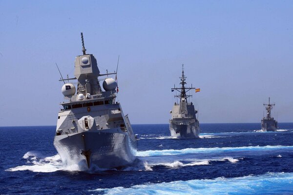Military warships sail on the sea