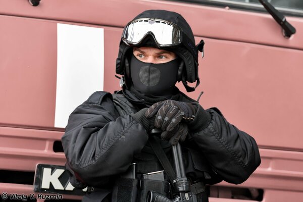 A special forces soldier with a weapon in a mask