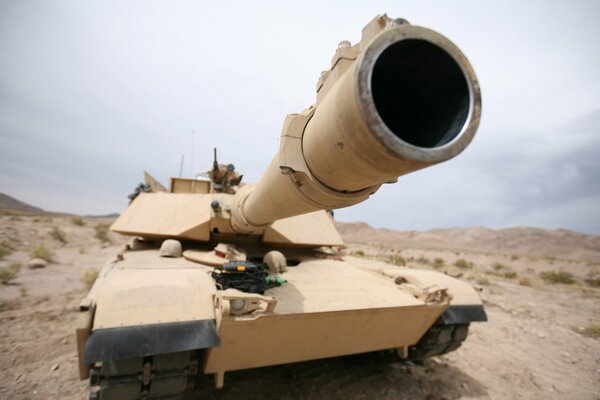 A tank in the sand-colored desert
