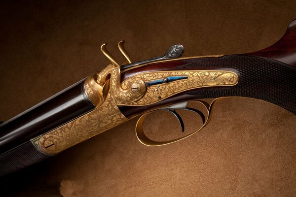 A double-barreled shotgun decorated with a vintage pattern