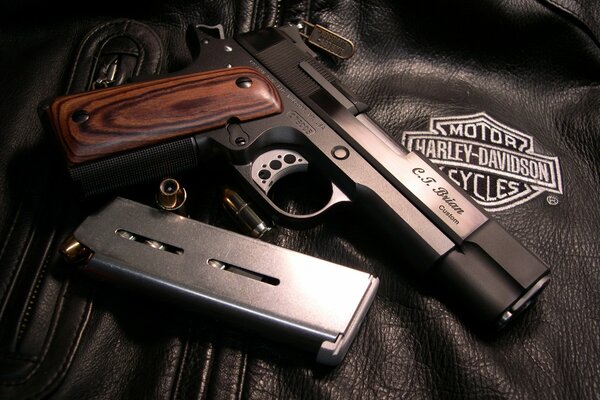 The colt and the cartridges are on the leather jacket