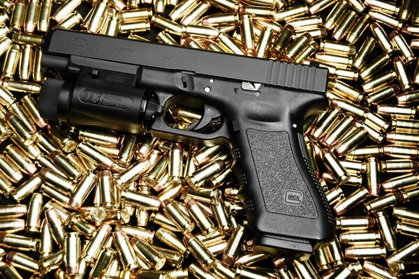Photo of a glock 35 pistol on a cartridge background