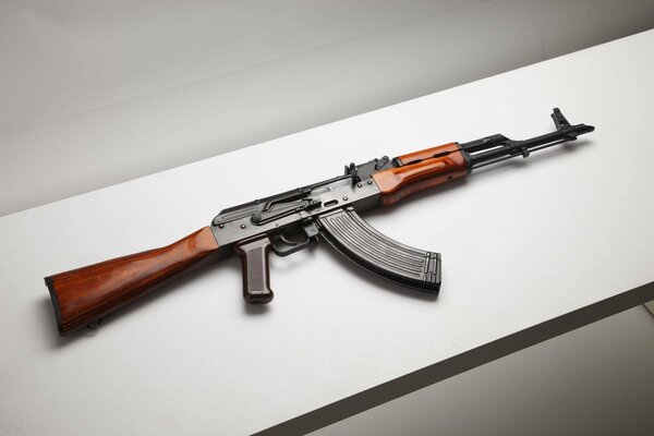 Kalashnikov assault rifle upgraded on a gray shelf