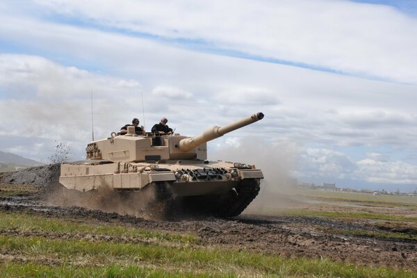 Soldiers are riding on the leopard 2 tank