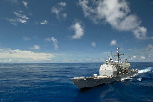 A warship sails on the ocean