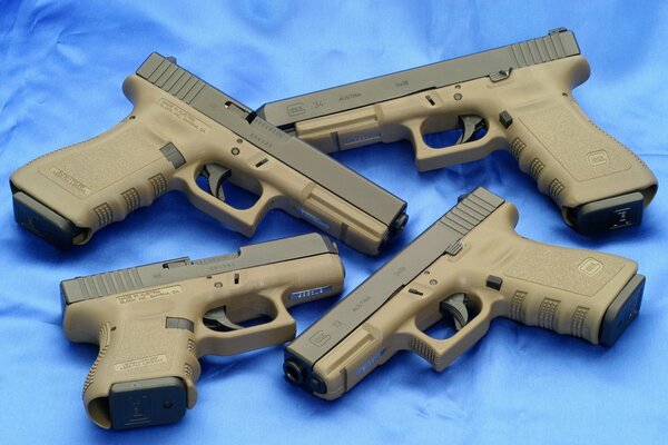 Legendary Glock pistols on a light blue background