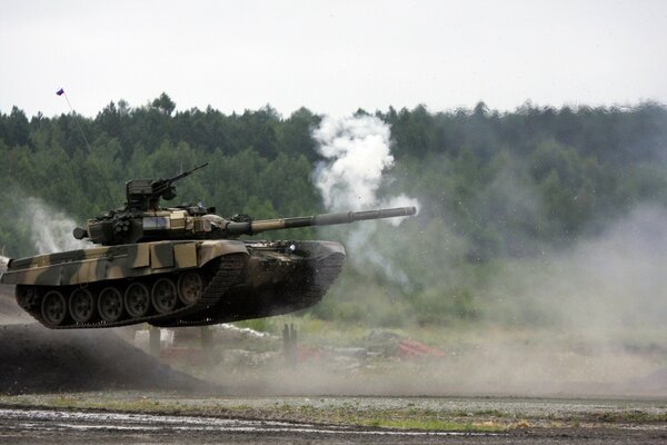 The tank overcomes an obstacle in a jump