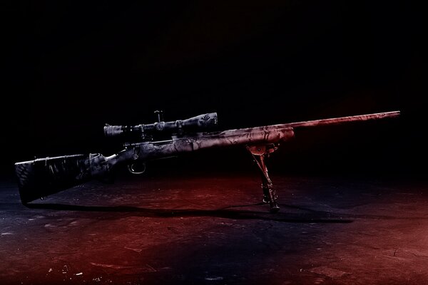 A sniper rifle stands on a red background