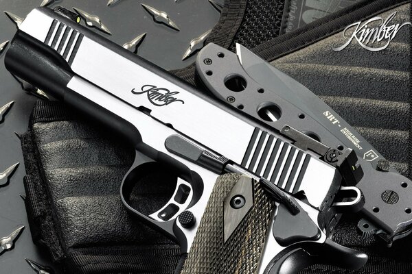 Pistol with a knife, black and white