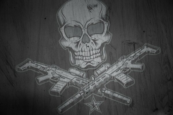 Emblem with a skull and machine guns