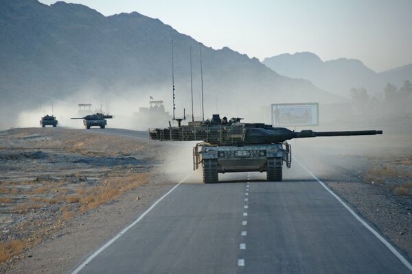 A column of Leopard 2a6 tanks on the road in Afghanistan