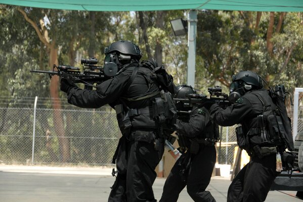 Special forces in masks, bulletproof vests, armed