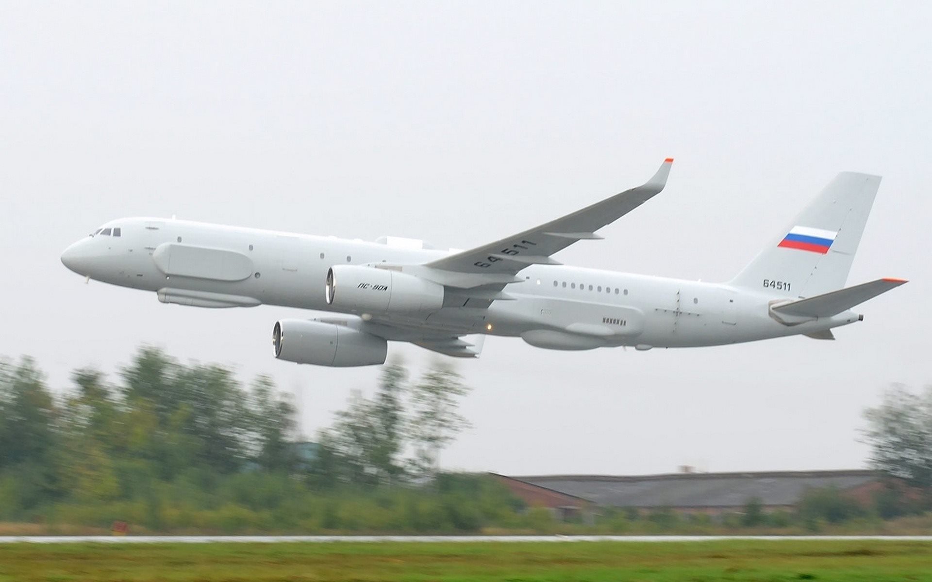 tupolev tu-214 p plane low airport runway wings engine