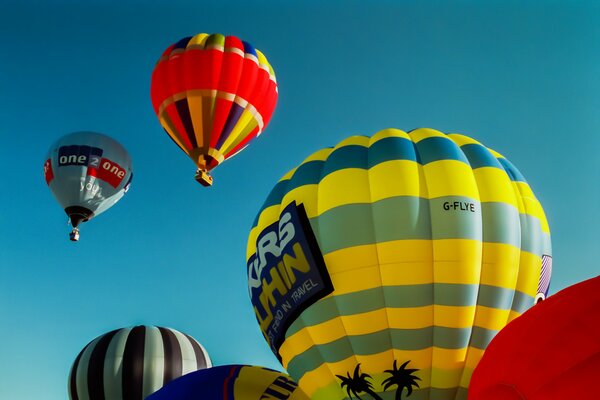 Beautiful balloons on the sky background