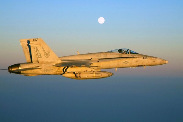 Military fighter on the background of the moon