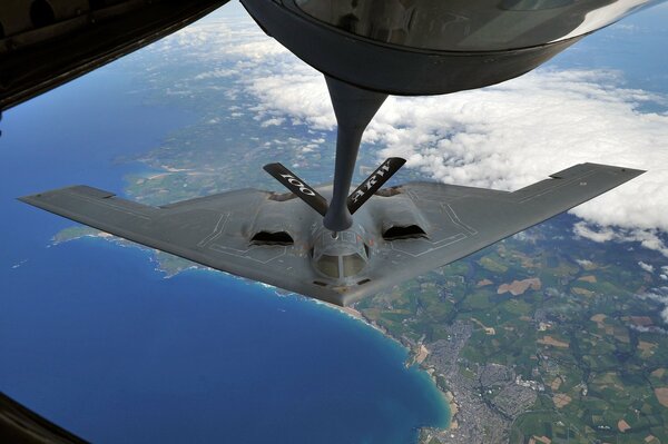 A strategic bomber refuels in the air