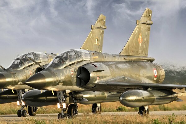 Military fighters against a stormy sky