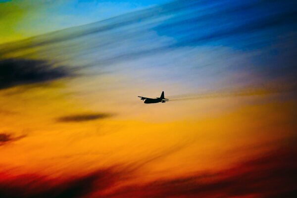 The silhouette of an airplane was seen in the sky glow