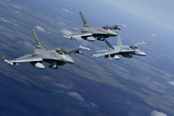 Hornet fighters flying over the landscape