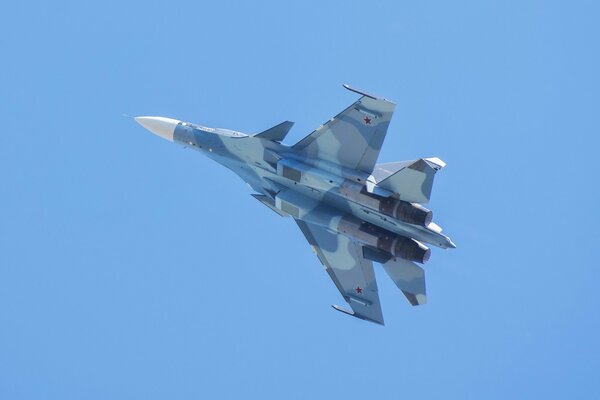 Russian Su-30 aircraft in flight bottom view