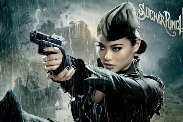 Beautiful Asian woman in a cap with a gun