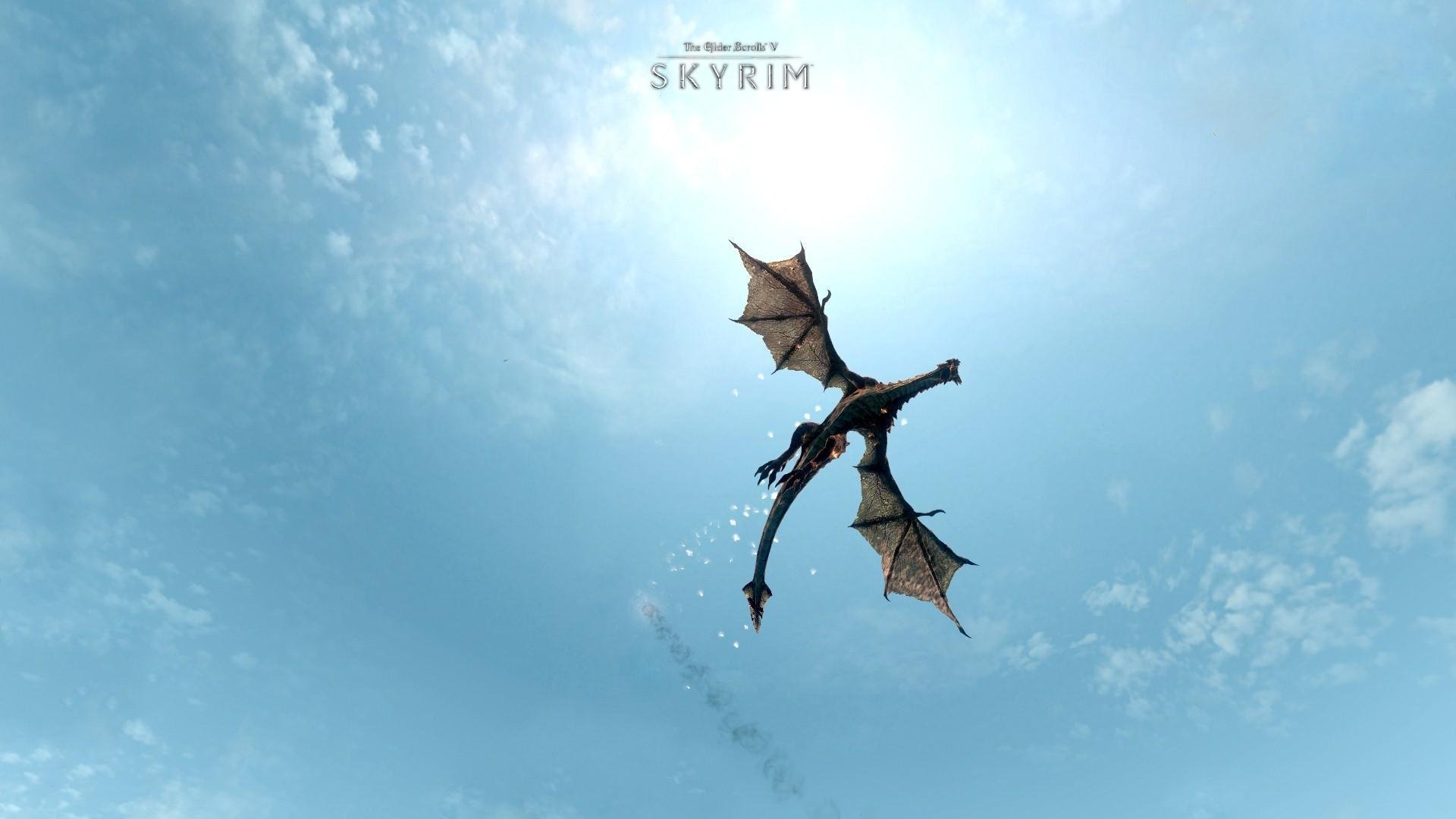 the elder scrolls v: skyrim game dragon wings sky blue flight