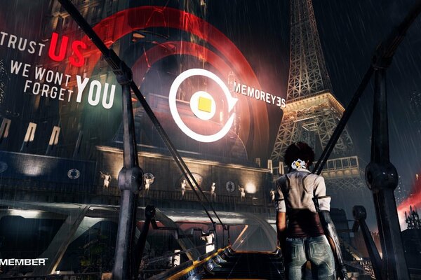 A man stands facing the Eiffel Tower at night