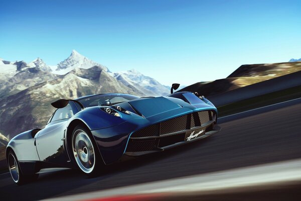 A modern beautiful black car rushes along the highway against the background of mountains