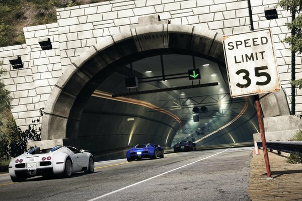 The road , the tunnel and the racing cars that leave it