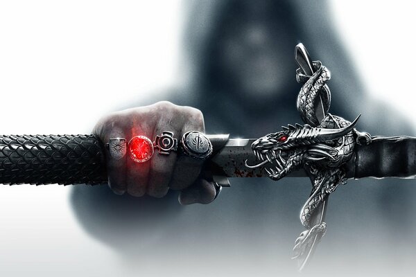 Dragón Age 3 mano con 4 anillos y espada en la mano