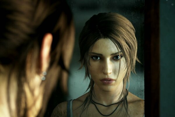 Lara Croft looks at her face in the mirror