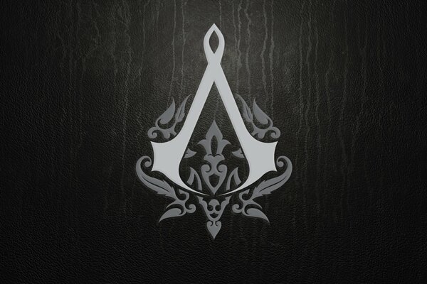 The logo of the game Assassins Creed on a black background