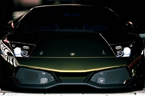 Black matte Lamborghini with headlights on