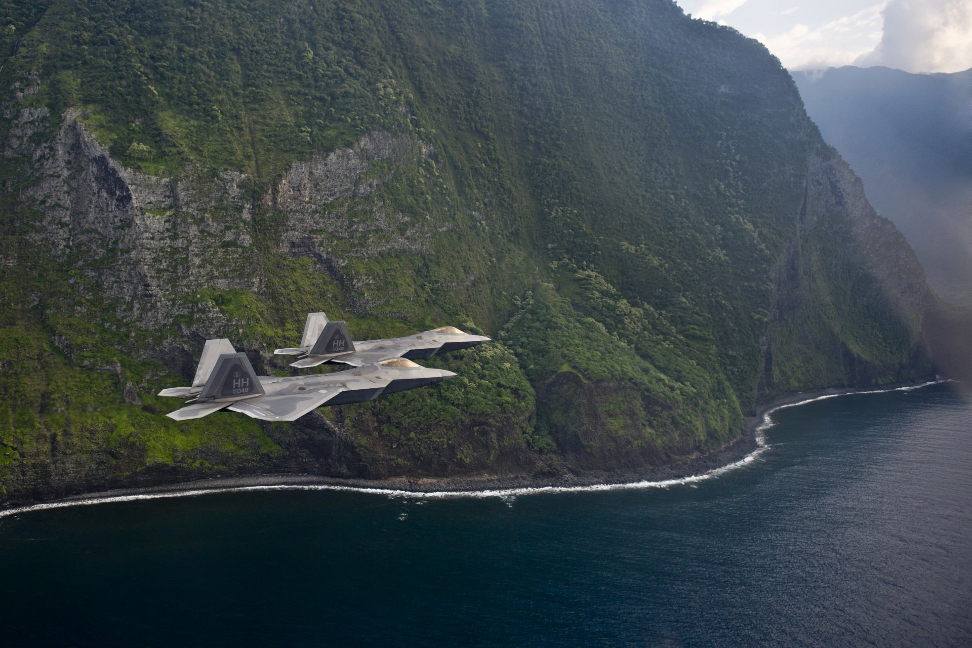 f-22 raptor aviones de combate vuelo costa