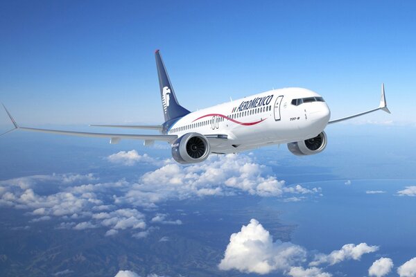 A Boeing 747 passenger plane in the sky above the clouds