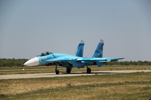 A large Su-27 fighter at the airfield