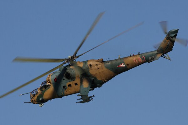 Military helicopter in a cloudless sky