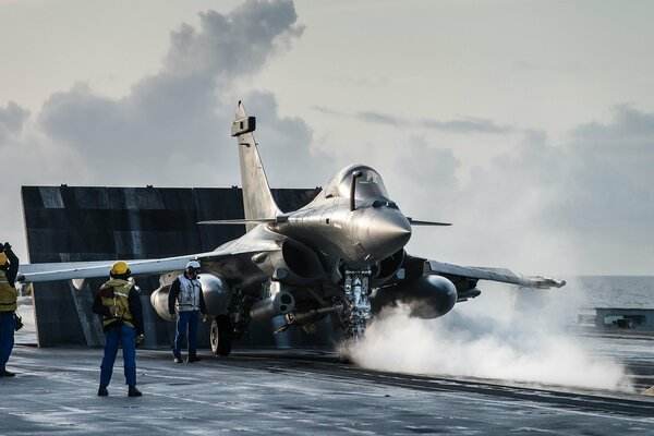 Take-off of a fighter plane from the deck of a carob