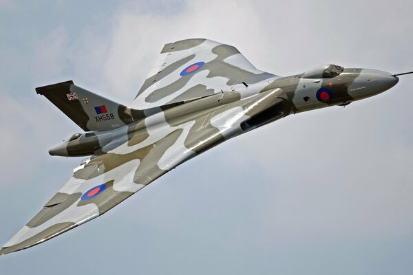 Combat aircraft in camouflage in the sky