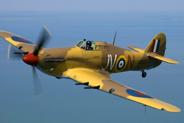 A fighter plane with a pilot in the cockpit