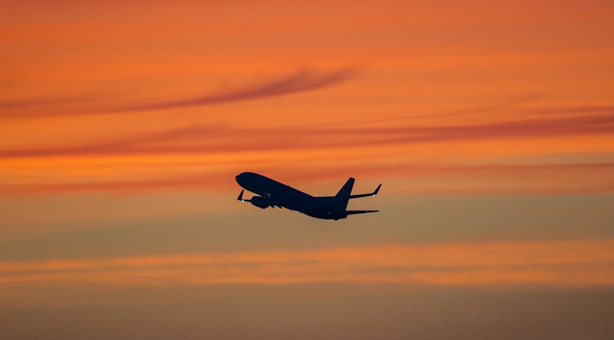 avion paquebot ciel nuages lueur