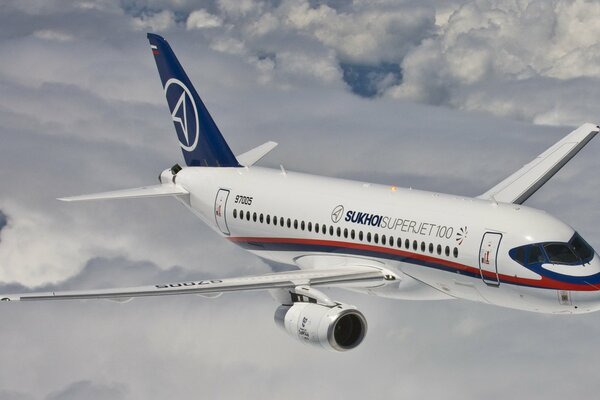 Passenger plane on a blue sky background