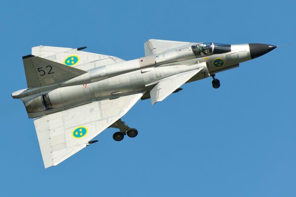 The flight of the Swedish multi-purpose fighter viggen in the blue sky